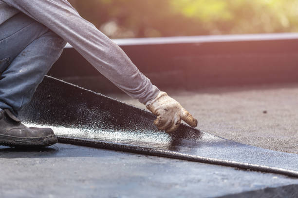Professional Basement Waterproofing technician working in West Liberty, OH